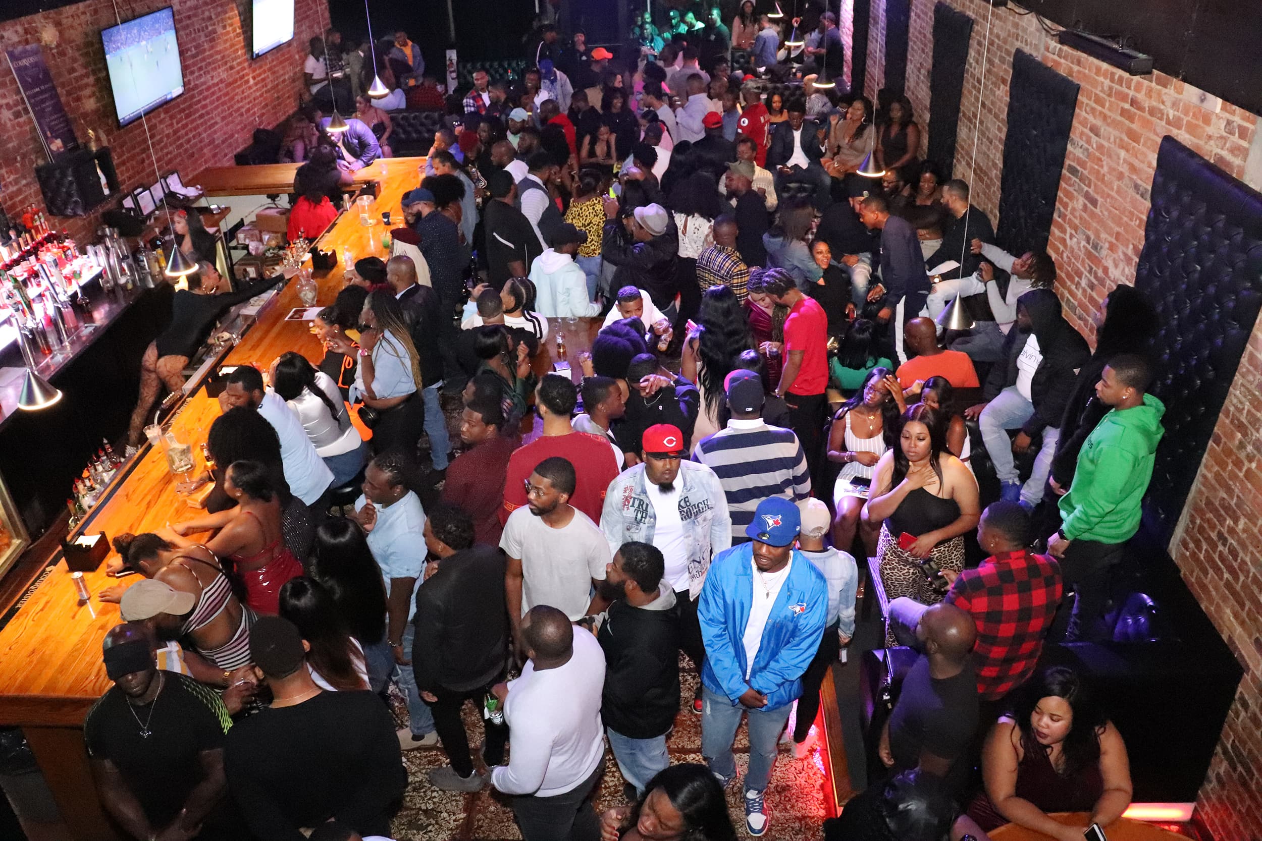 A crowd celebrating under stage lights